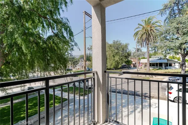 a view of a street from a balcony