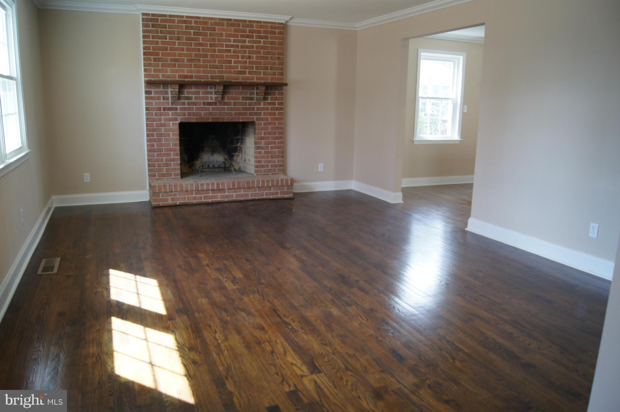 536 Anneslie Road Baltimore, MD 21212 - Photo 3 of 25 Living Room with fireplace and gorgeous floors