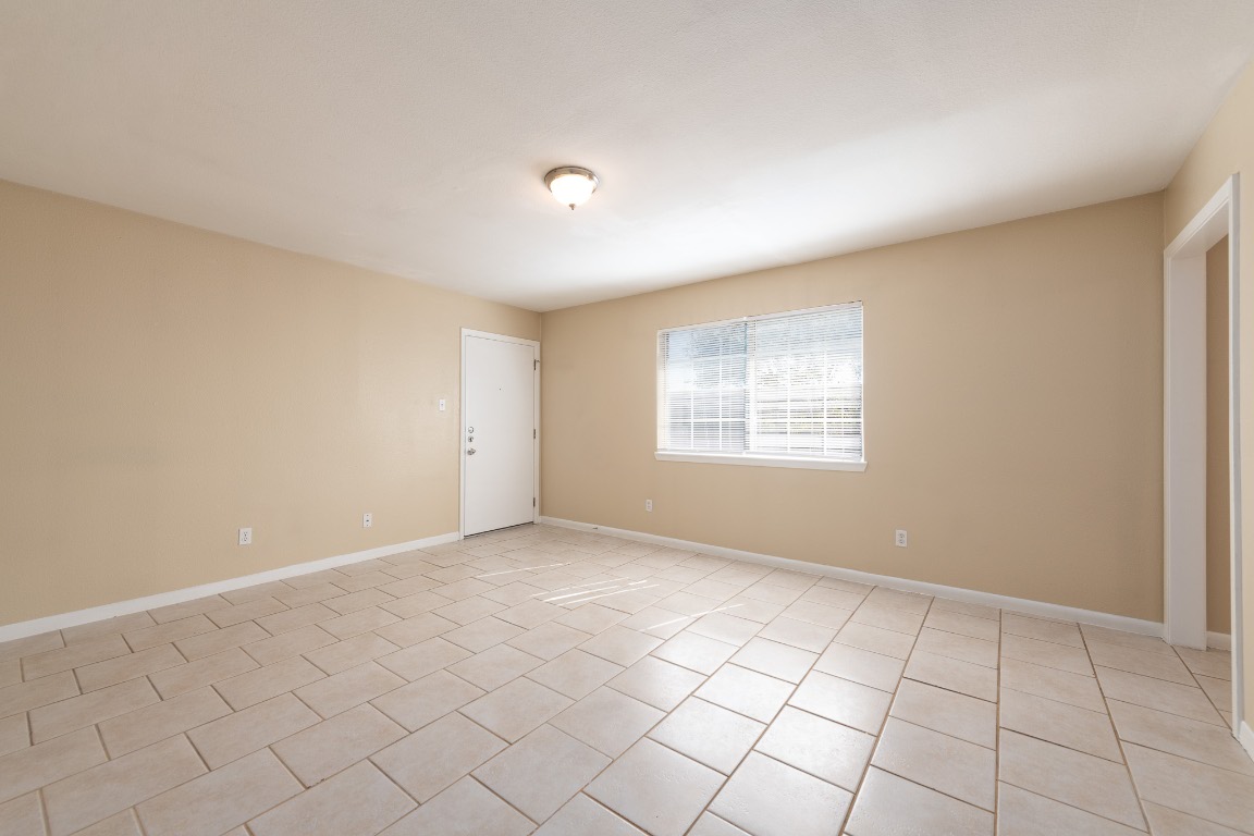 Undisclosed Address Austin, TX 78752 - Photo 3 of 13 a view of an empty room with a window