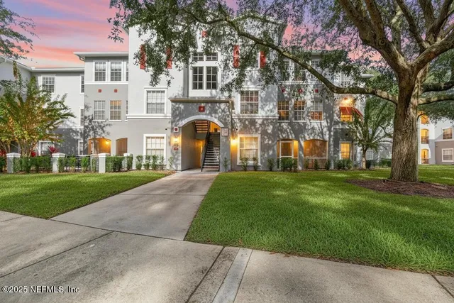 a view of a building with a yard