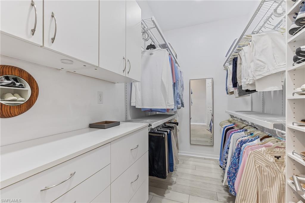 1211 Egrets Landing, Unit 202 Naples, FL 34108 - Photo 14 of 26 Customized Walk-in Closet