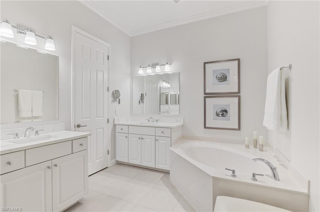 1211 Egrets Landing, Unit 202 Naples, FL 34108 - Photo 15 of 26 Glass Enclosed Shower, Soaking Tub, Dual Vanities