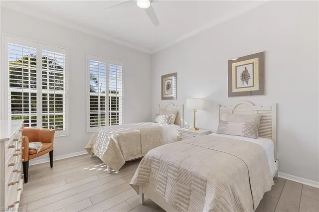 a spacious bathroom with a tub sink and mirror