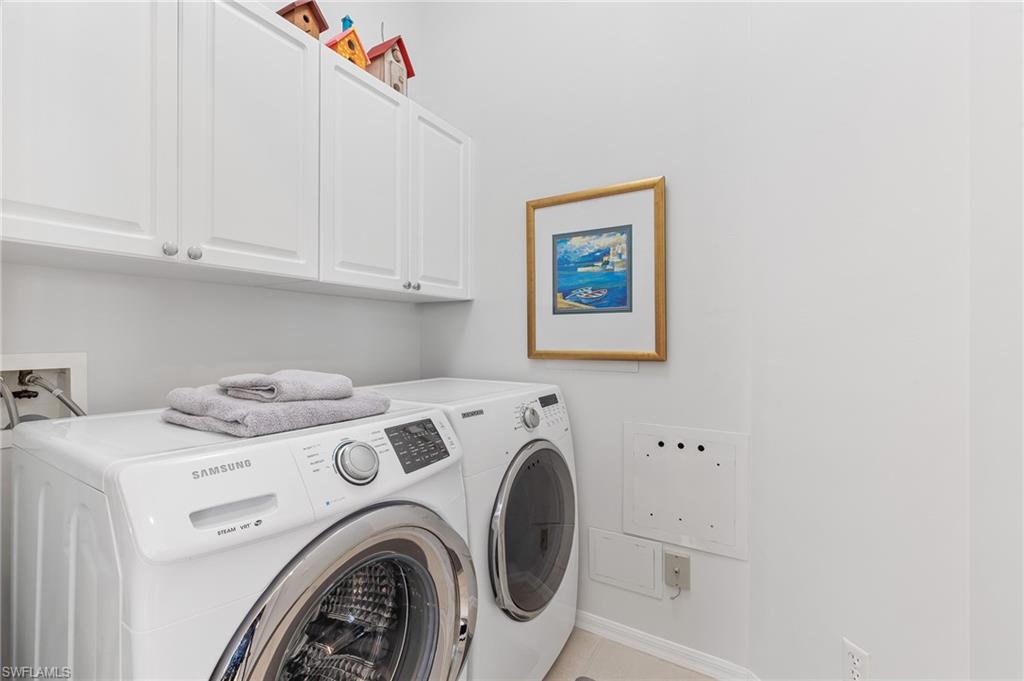 1211 Egrets Landing, Unit 202 Naples, FL 34108 - Photo 19 of 26 Laundry Room w/ Storage