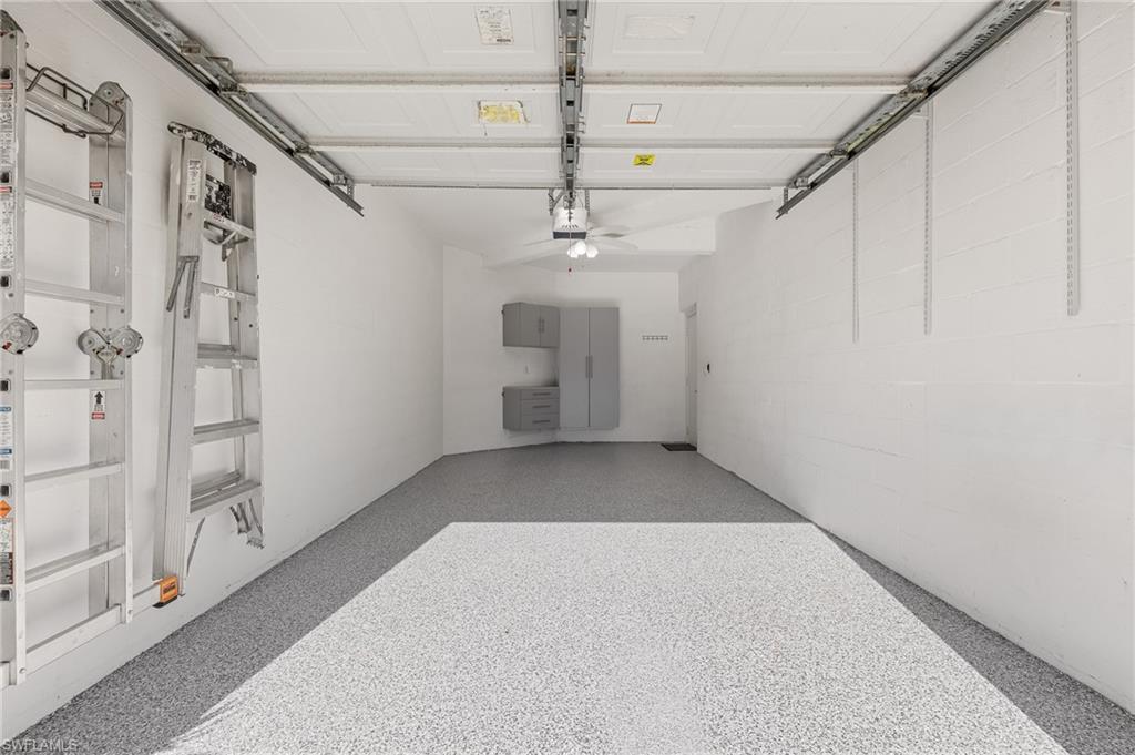 1211 Egrets Landing, Unit 202 Naples, FL 34108 - Photo 20 of 26 1 Car Garage, Epoxy Floors, Built-ins
