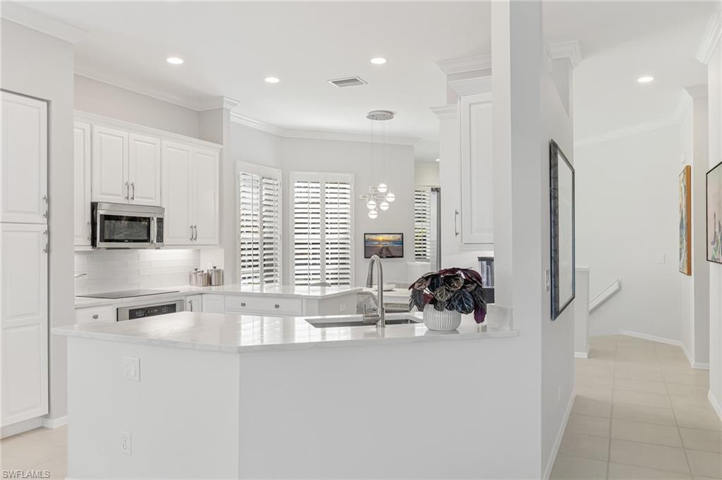 1211 Egrets Landing, Unit 202 Naples, FL 34108 - Photo 7 of 26 Glass Tile Backsplash