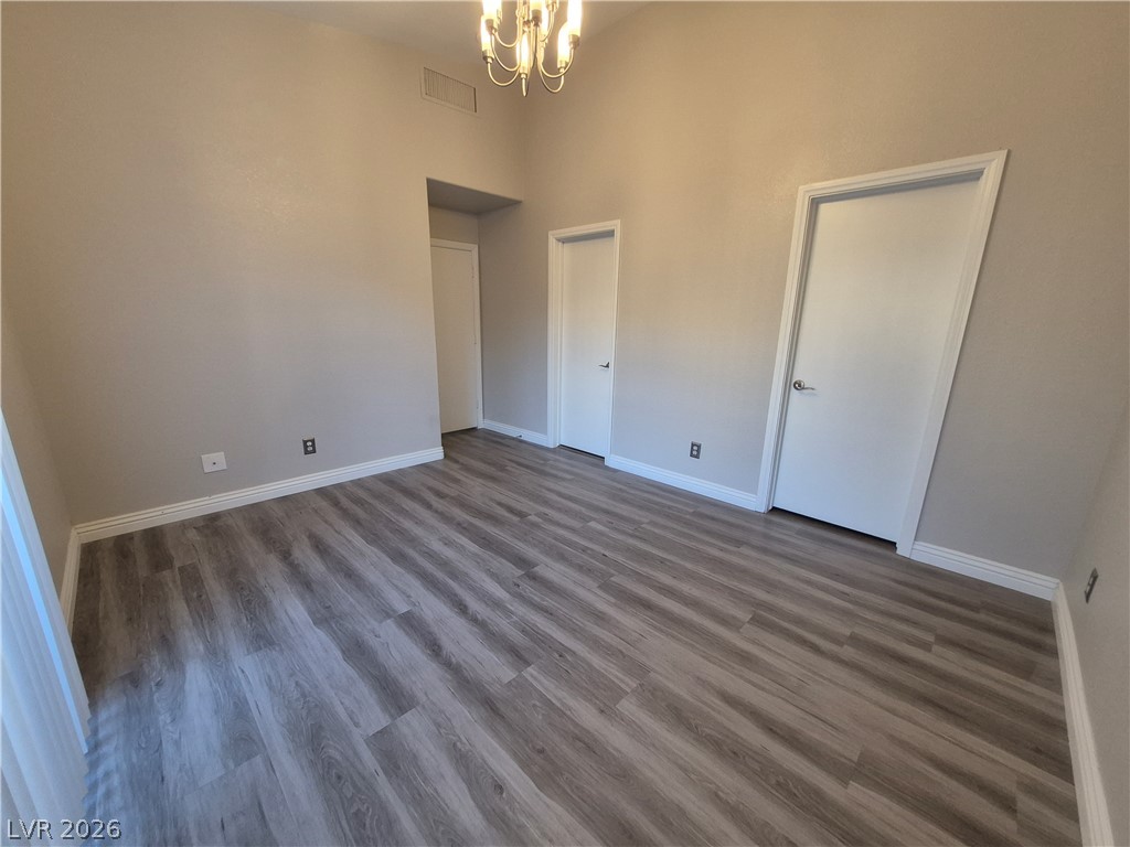 2053 Quarry Ridge Street, Unit 201 Las Vegas, NV 89117 - Photo 10 of 21 Newly installed wood flooring creates a refreshed, airy feel in this spacious room.