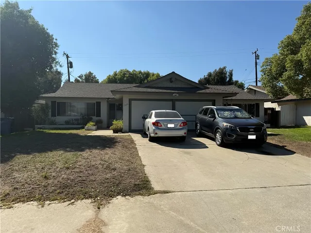 a view of a car parked in front of a house