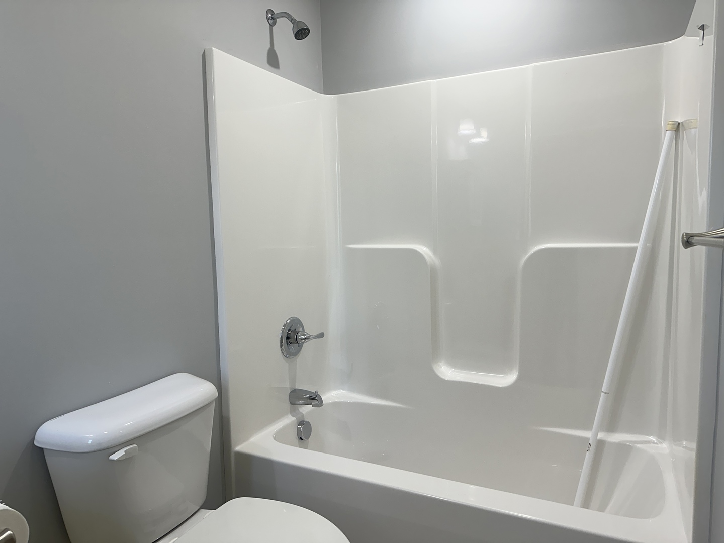 1519 Pine Street Murphysboro, IL 62966 - Photo 9 of 12 a white toilet sitting next to a bath tub