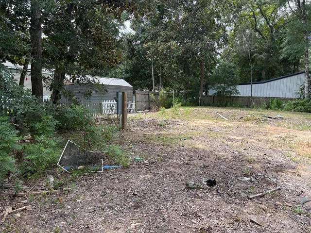 a backyard of a house with lots of green space