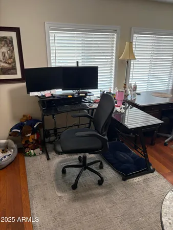 a view of a workspace with a window and sitting area