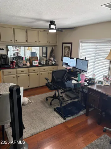 a view of a kitchen with refrigerator and sink