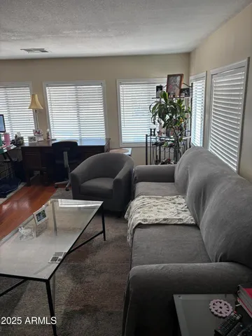 a kitchen with stainless steel appliances a stove a microwave and sink