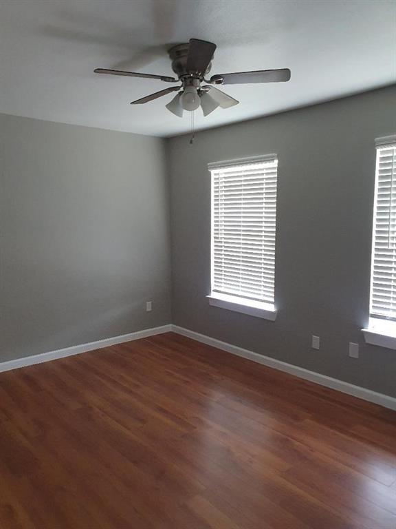 9821-9823 Sycamore Street Little Elm, TX 75068 - Photo 3 of 7 a view of an empty room with a window