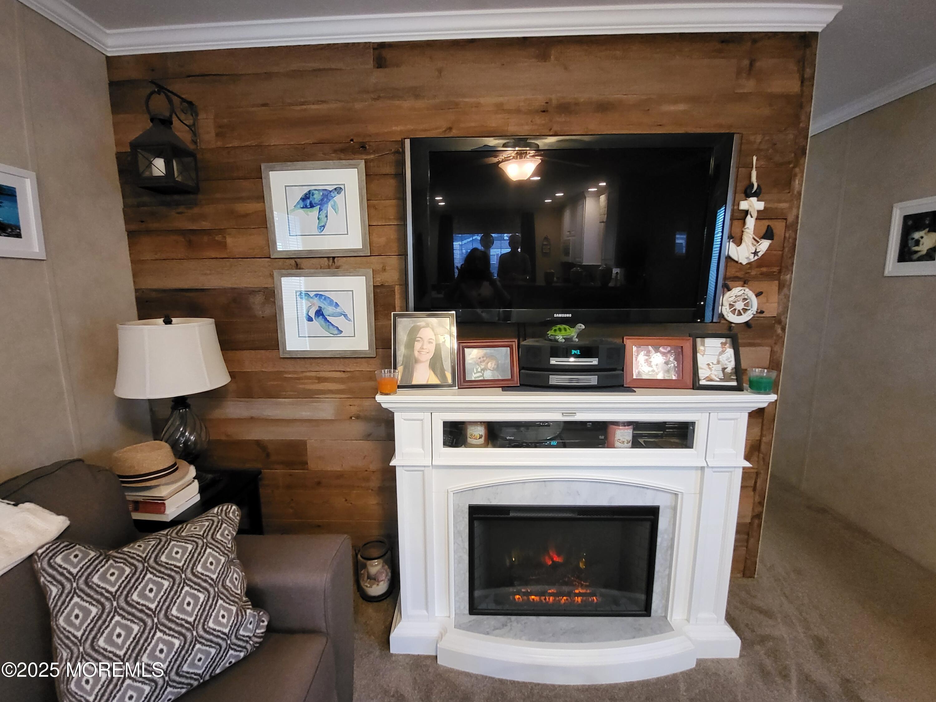 9 Shorehaven Road Hazlet, NJ 07730 - Photo 11 of 20 a living room with furniture and a fireplace