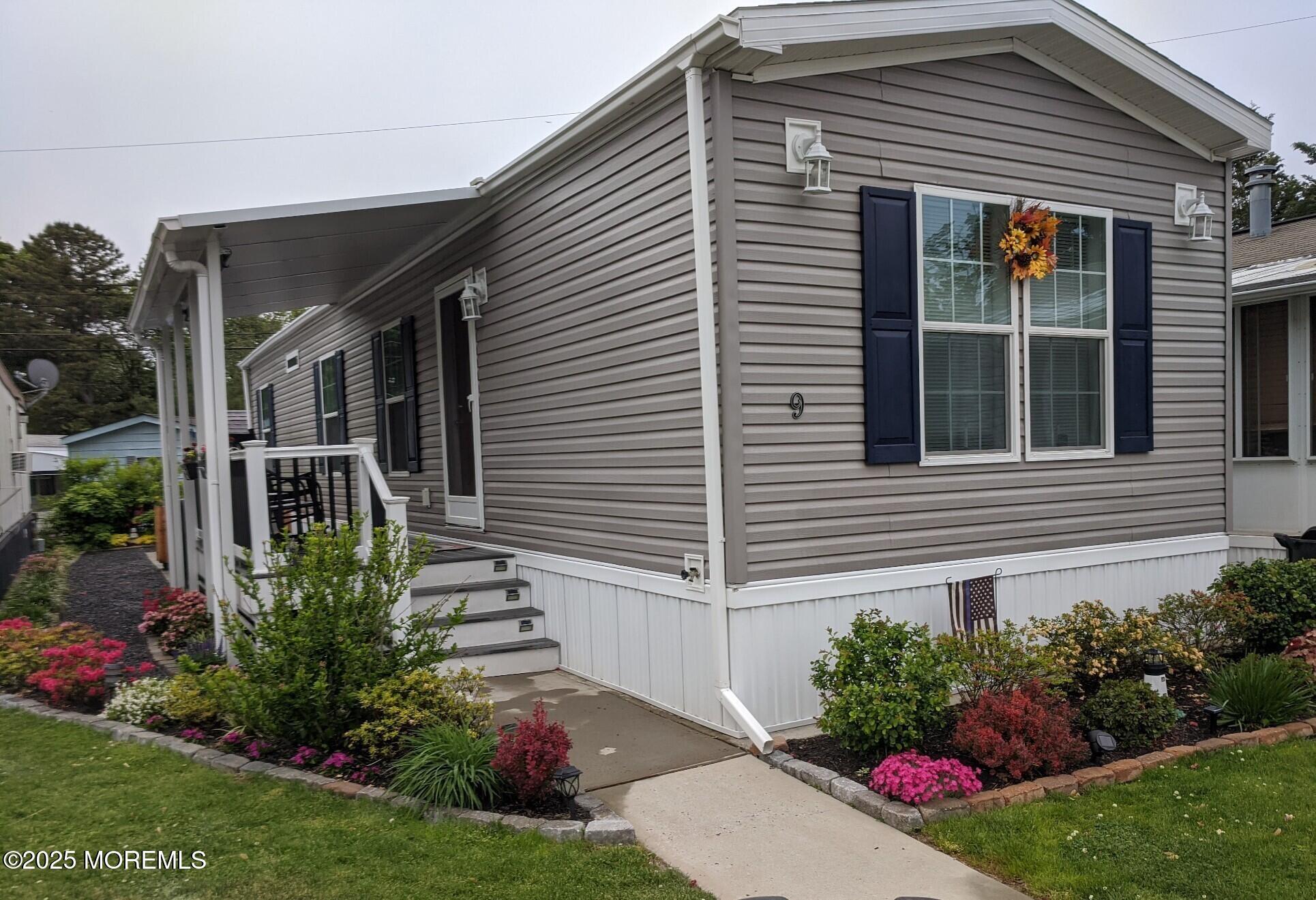 9 Shorehaven Road Hazlet, NJ 07730 - Photo 3 of 20 a view of a house with a yard and garden