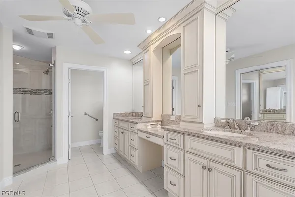 a bathroom with a double vanity sink mirror and double