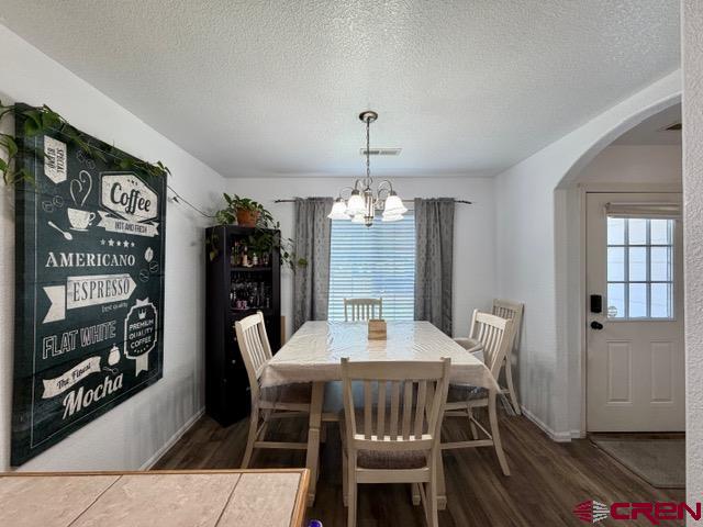 544 20th Street Delta, CO 81416 - Photo 7 of 44 a view of a dining room with furniture and wooden floor