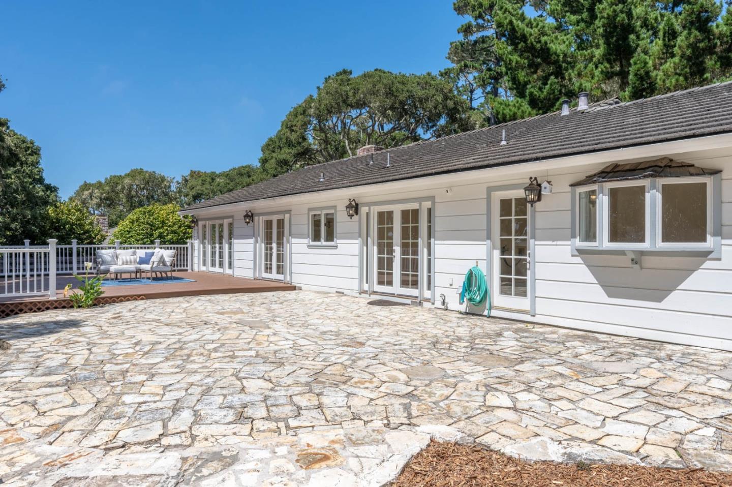 1044 Lost Barranca Road Pebble Beach, CA 93953 - Photo 11 of 15 a view of a house with backyard and sitting area
