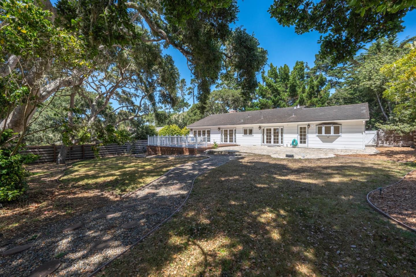 1044 Lost Barranca Road Pebble Beach, CA 93953 - Photo 14 of 15 a house with swimming pool in front of it