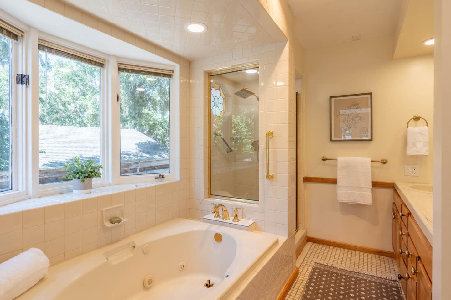 1044 Lost Barranca Road Pebble Beach, CA 93953 - Photo 8 of 15 a bathroom with a bathtub and a shower