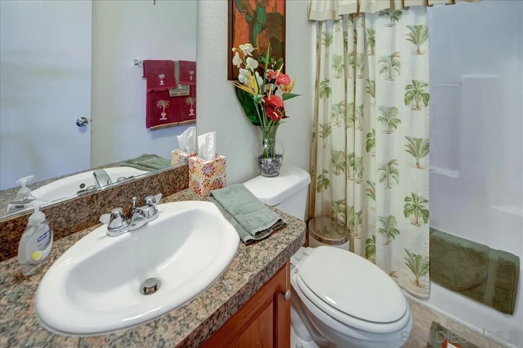 5495 Acorn Patch Road Julian, CA 92036 - Photo 16 of 23 a bathroom with a granite countertop toilet sink and mirror