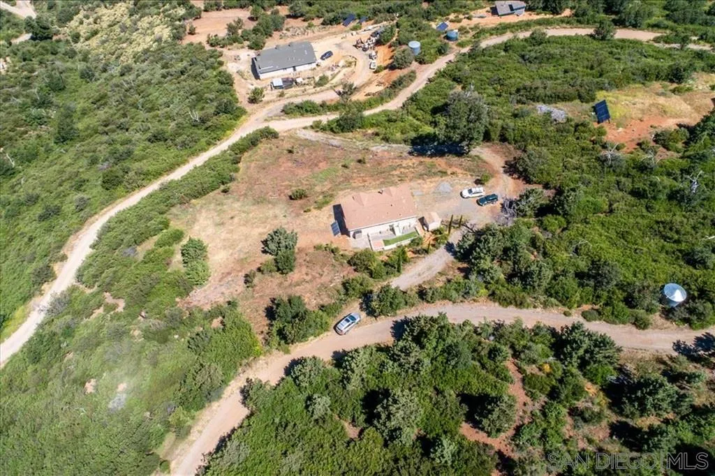 5495 Acorn Patch Road Julian, CA 92036 - Photo 20 of 23 an aerial view of a house with a yard and large trees