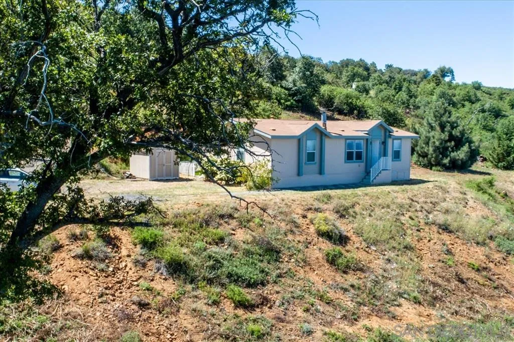 5495 Acorn Patch Road Julian, CA 92036 - Photo 2 of 23 a view of a house with a yard