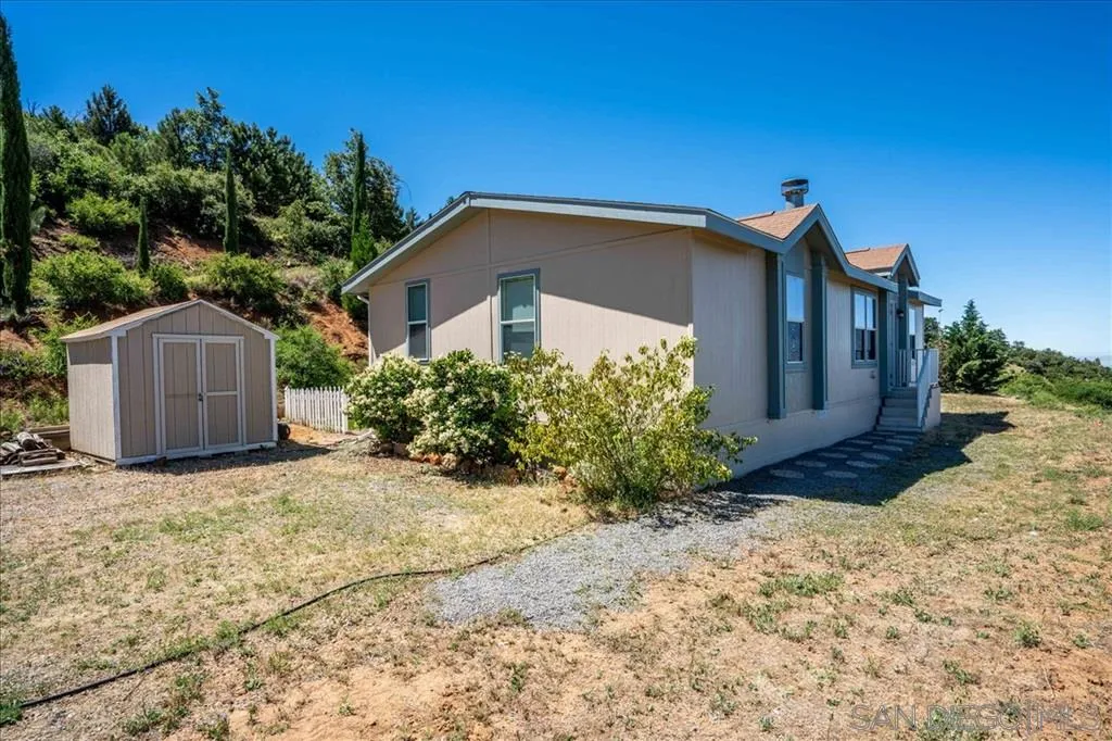 5495 Acorn Patch Road Julian, CA 92036 - Photo 4 of 23 a view of a house with a yard and plants