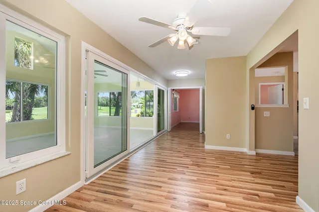 a view of a hallway with a chandelier