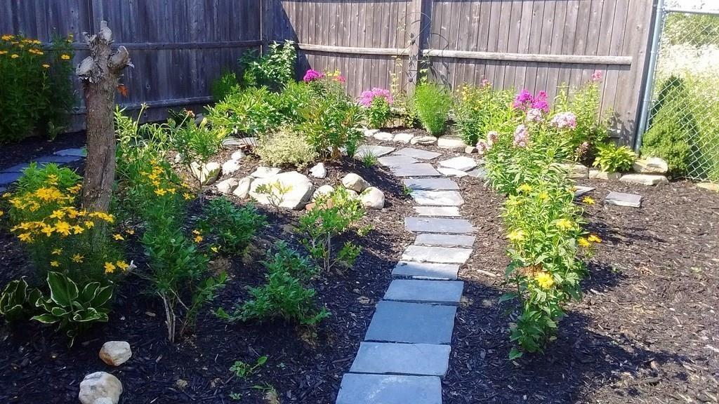 346 Knowlton Corner Road Farmington, ME 04938 - Photo 18 of 33 Walkway through flower garden.