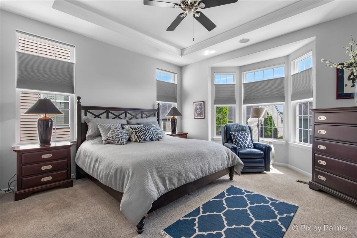 3879 Seigle Drive Elgin, IL 60124 - Photo 14 of 44 a bedroom with a bed and a mirror