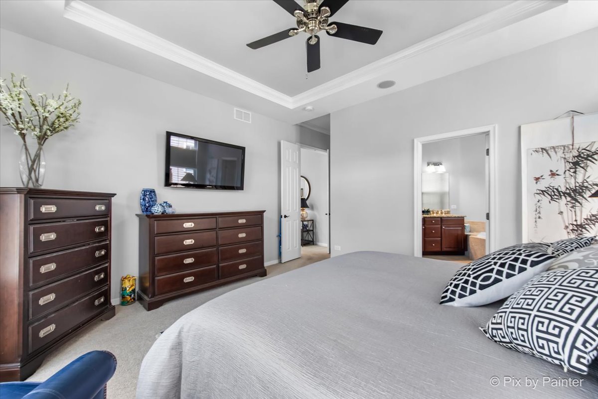 3879 Seigle Drive Elgin, IL 60124 - Photo 15 of 44 a bedroom with a bed and a television