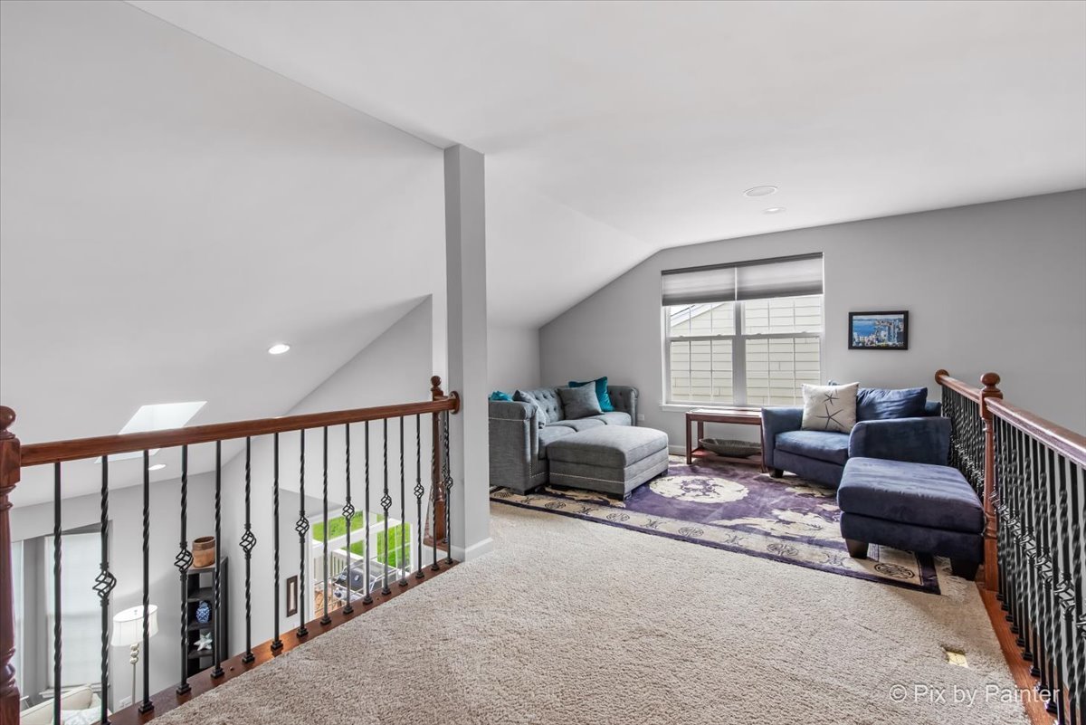 3879 Seigle Drive Elgin, IL 60124 - Photo 21 of 44 a living room with furniture and a floor to ceiling window