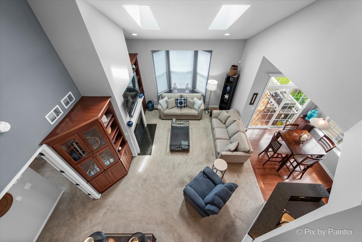 3879 Seigle Drive Elgin, IL 60124 - Photo 23 of 44 a living room with furniture and a flat screen tv