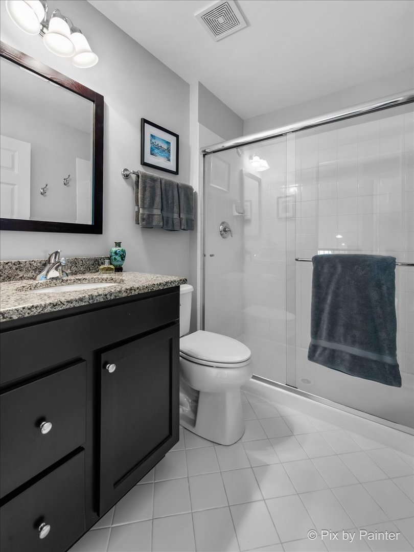 3879 Seigle Drive Elgin, IL 60124 - Photo 25 of 44 a bathroom with a sink a toilet and shower