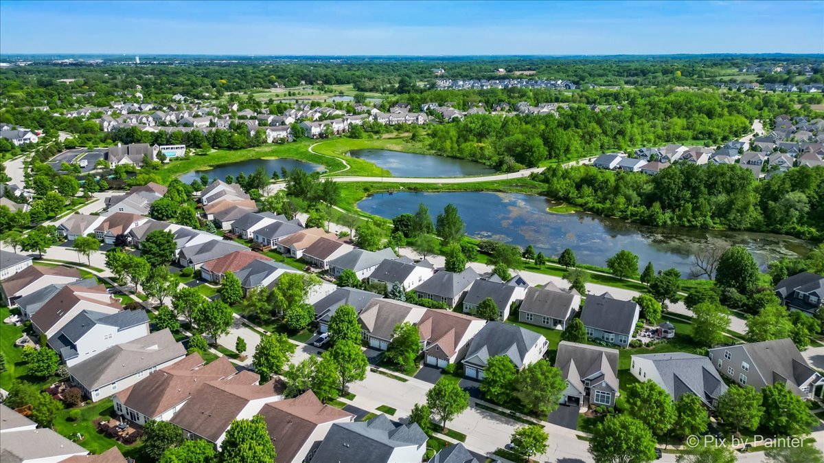 3879 Seigle Drive Elgin, IL 60124 - Photo 35 of 44 an aerial view of residential houses with outdoor space and trees