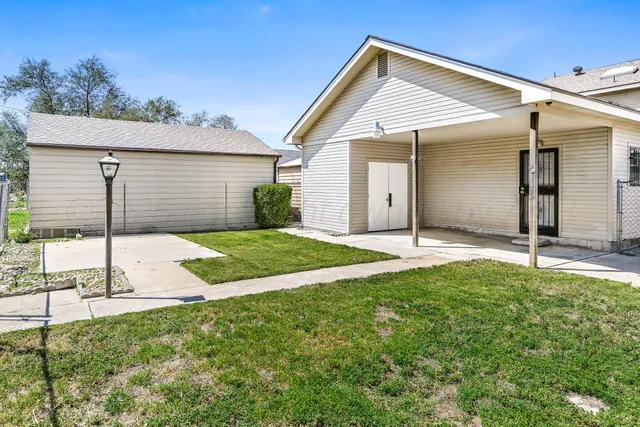 a view of a backyard with a garden and plants