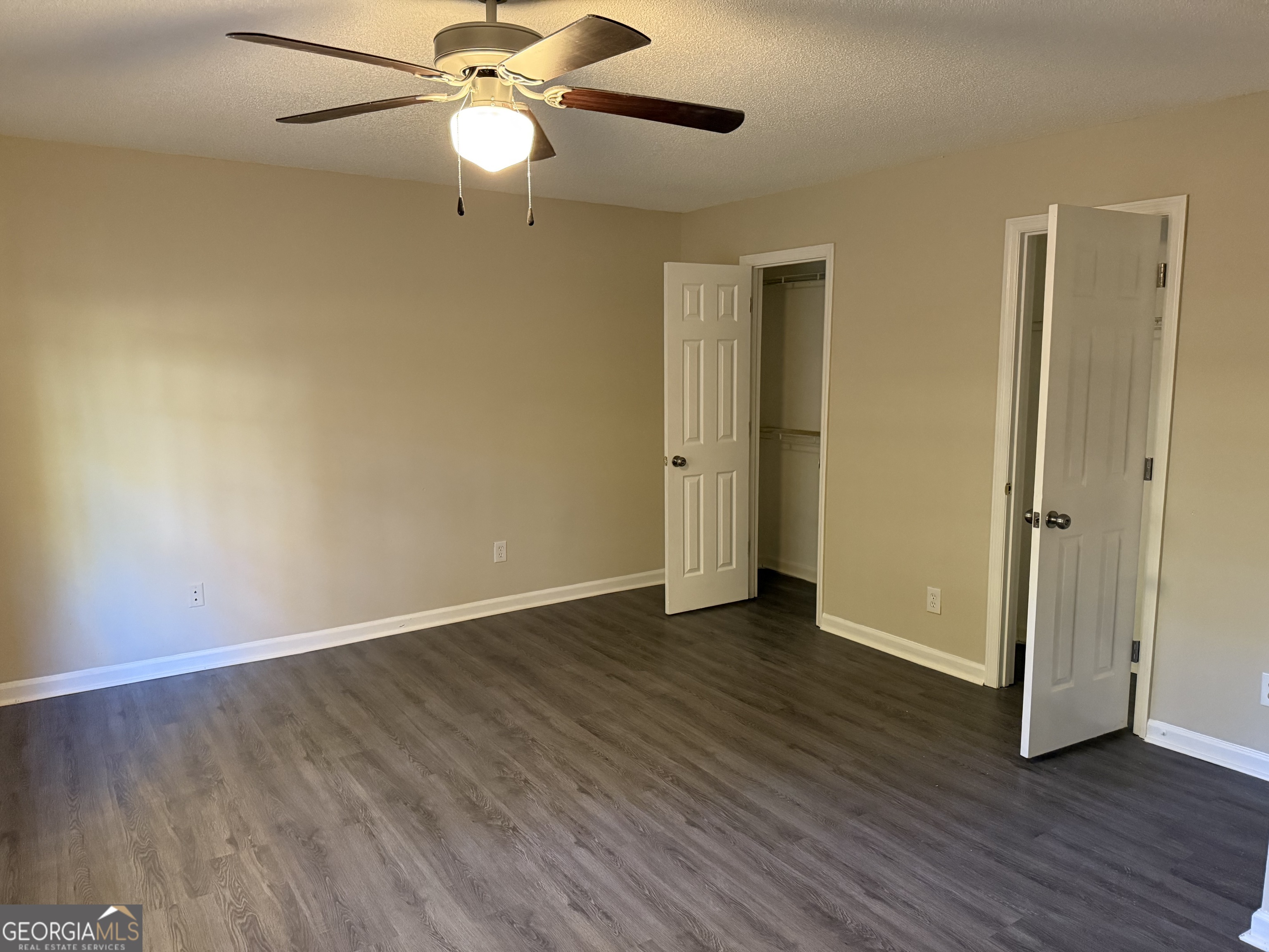 888 Timbercrest Court Lithonia, GA 30058 - Photo 5 of 13 a view of an empty room with wooden floor