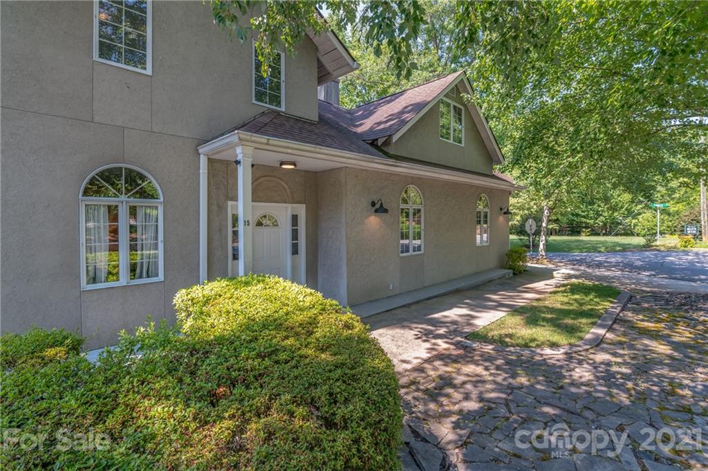 15 Doubleday Road Tryon, NC 28782 - Photo 2 of 46 a front view of a house with garden