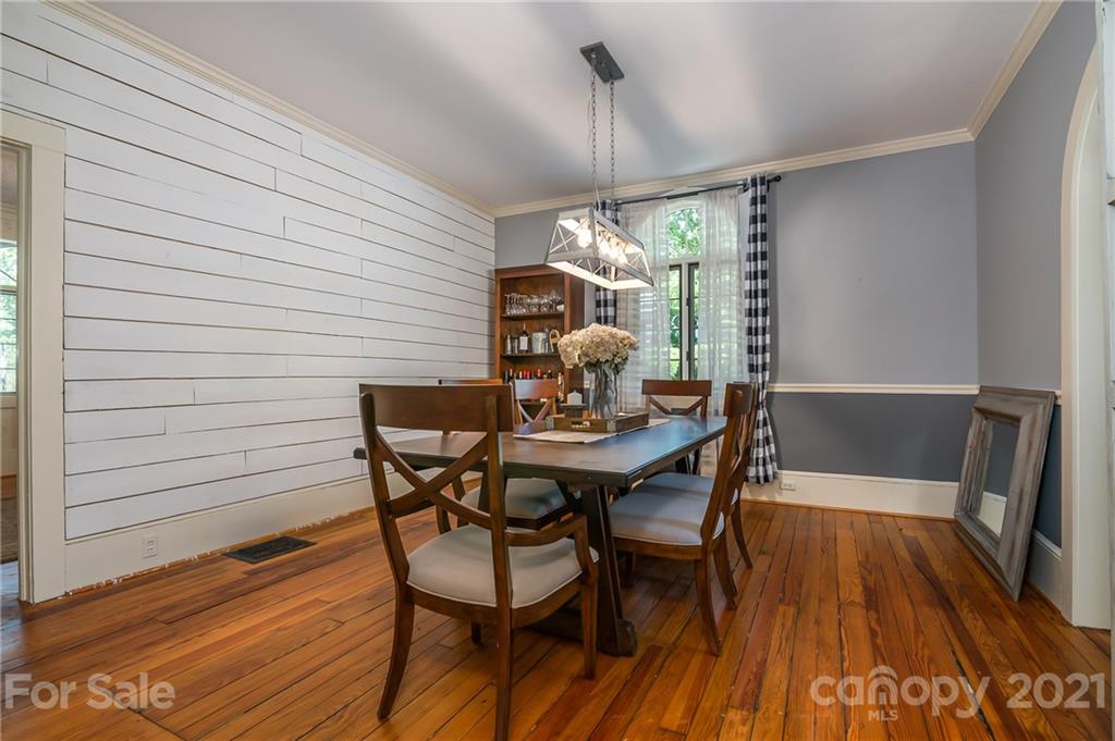 15 Doubleday Road Tryon, NC 28782 - Photo 12 of 46 a view of a dining room with furniture window and wooden floor