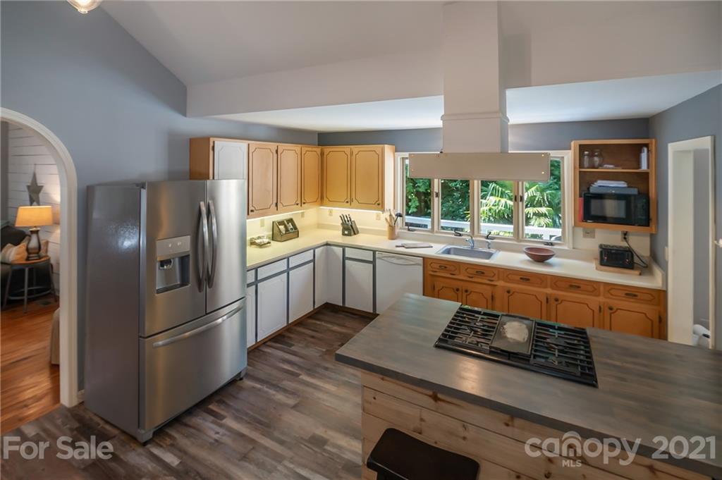 15 Doubleday Road Tryon, NC 28782 - Photo 14 of 46 a kitchen with stainless steel appliances a stove a sink and a refrigerator