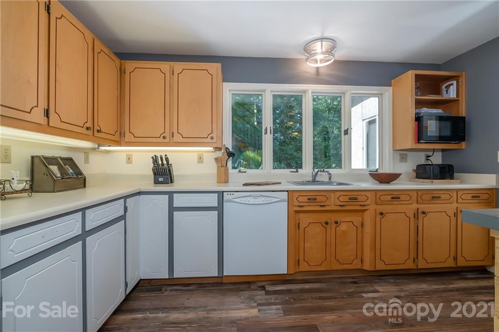 15 Doubleday Road Tryon, NC 28782 - Photo 16 of 46 a kitchen with granite countertop a sink cabinets stainless steel appliances and a window
