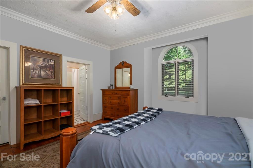 15 Doubleday Road Tryon, NC 28782 - Photo 17 of 46 a bed sitting in a bedroom next to a window