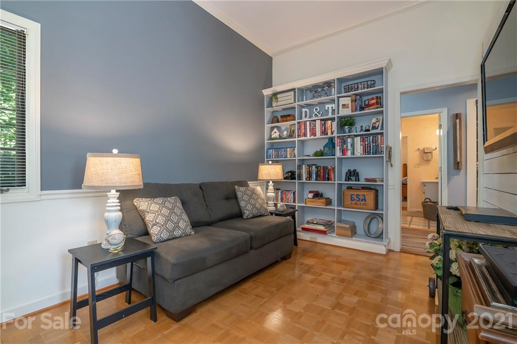 15 Doubleday Road Tryon, NC 28782 - Photo 20 of 46 a living room with furniture and a book shelf