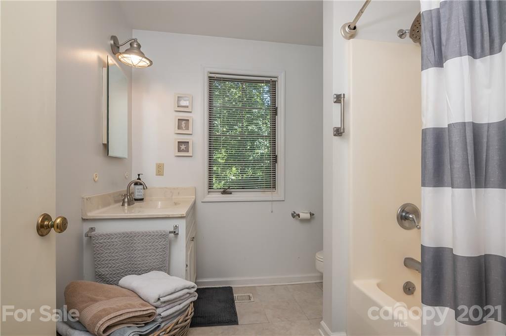 15 Doubleday Road Tryon, NC 28782 - Photo 24 of 46 a bathroom with a sink toilet and shower