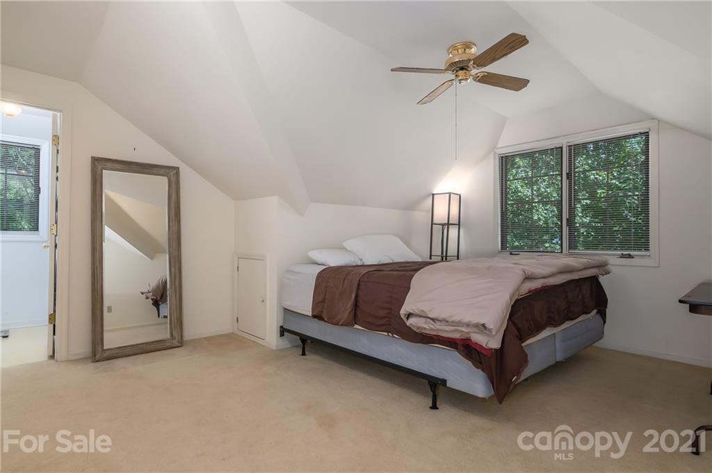15 Doubleday Road Tryon, NC 28782 - Photo 29 of 46 a large bed sitting in a bedroom next to a window