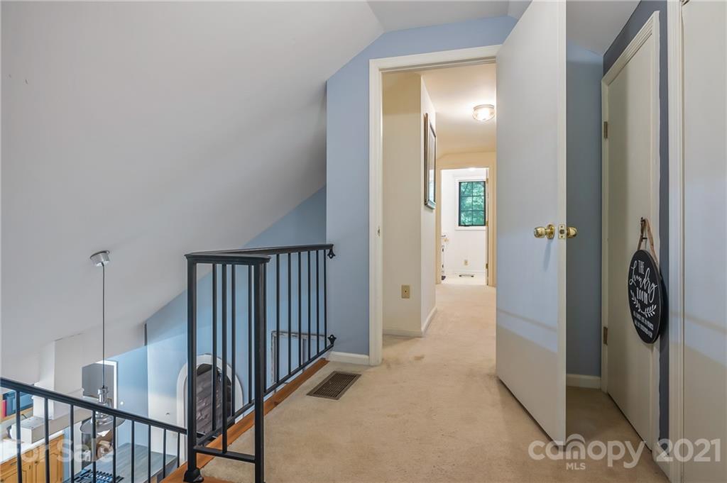15 Doubleday Road Tryon, NC 28782 - Photo 30 of 46 a view of a hallway with wooden floor and staircase