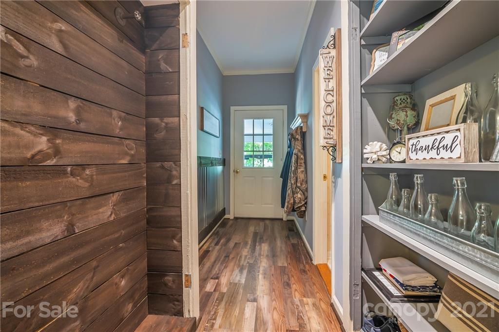 15 Doubleday Road Tryon, NC 28782 - Photo 31 of 46 a view of walk in closet with wooden floor