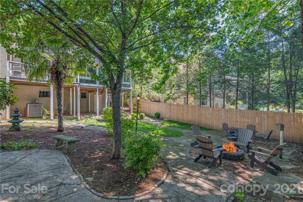 15 Doubleday Road Tryon, NC 28782 - Photo 43 of 46 a backyard of a house with table and chairs